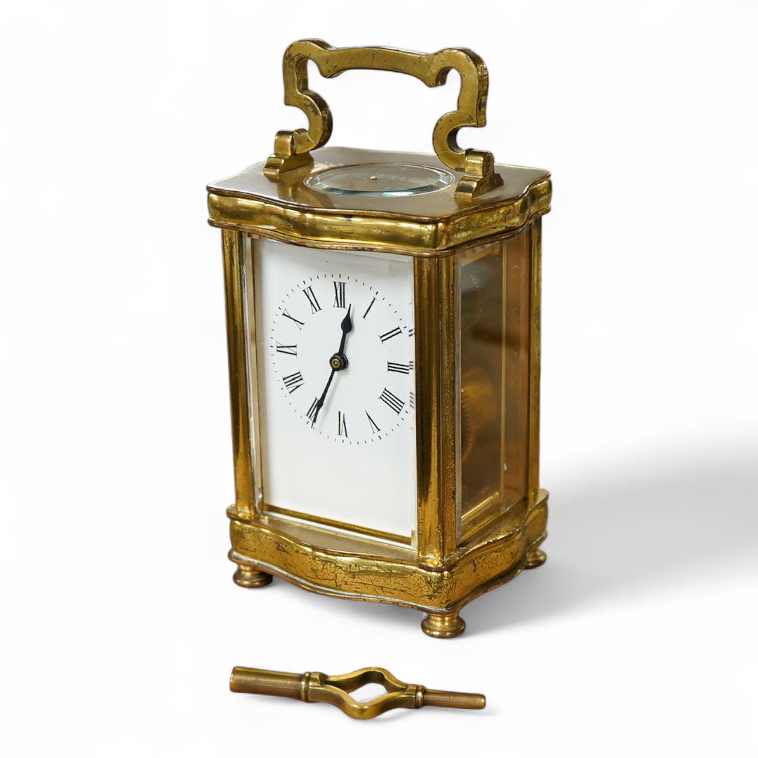 An early 20th century French gilt brass four glass carriage timepiece with key, 15cm high